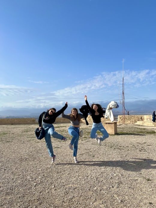 Girls jumping in air.