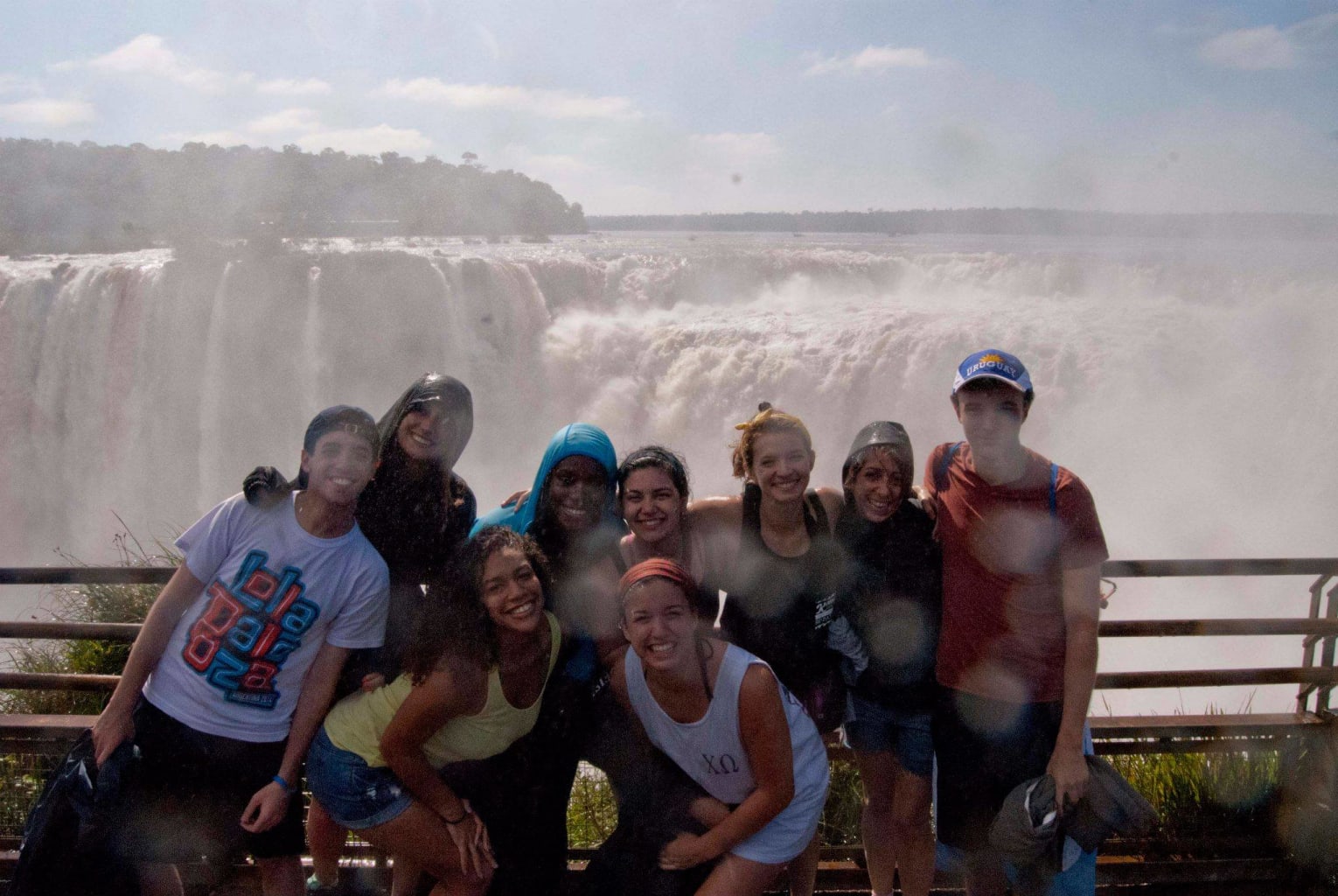 A group of students near a waterfall.