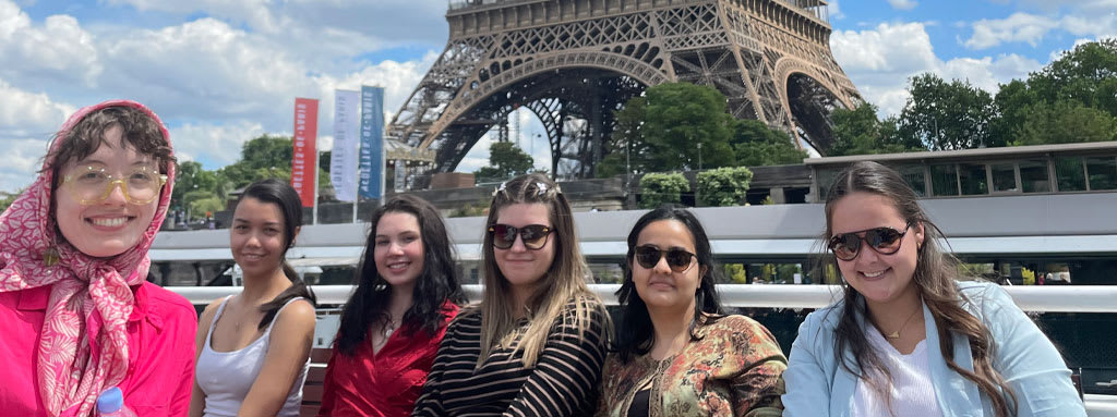 Students taking a river boat ride on the Seine in Paris, France.