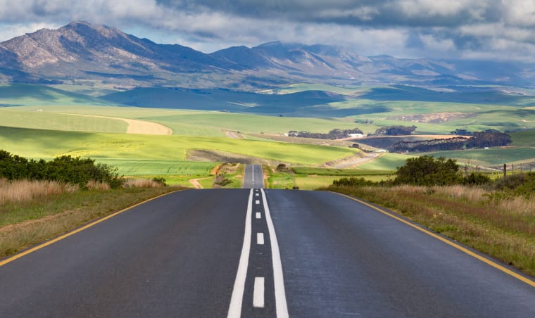 A road on a green landscape.