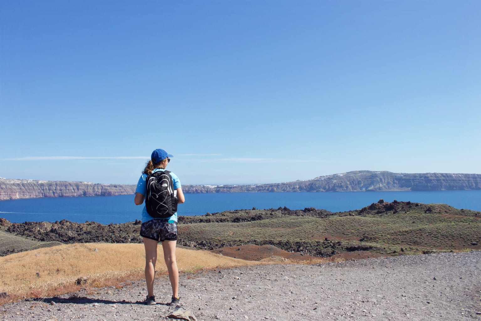 Person standing on rocks.