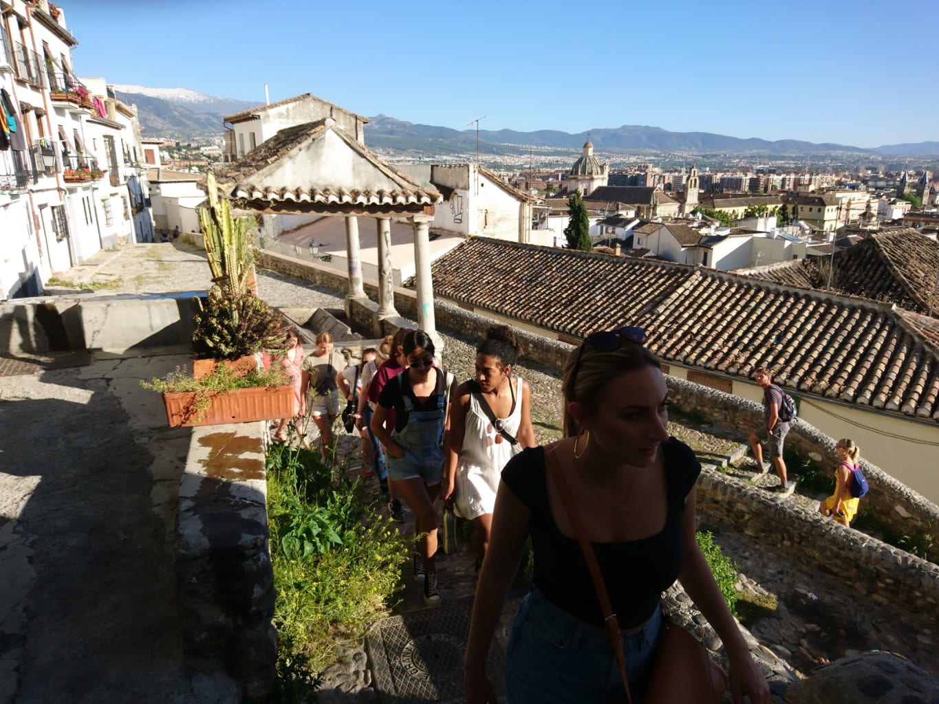 Girls walking up walkway.