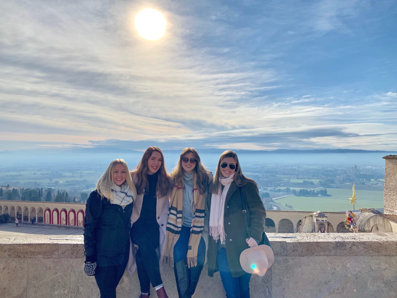 Girls posing in front of view.