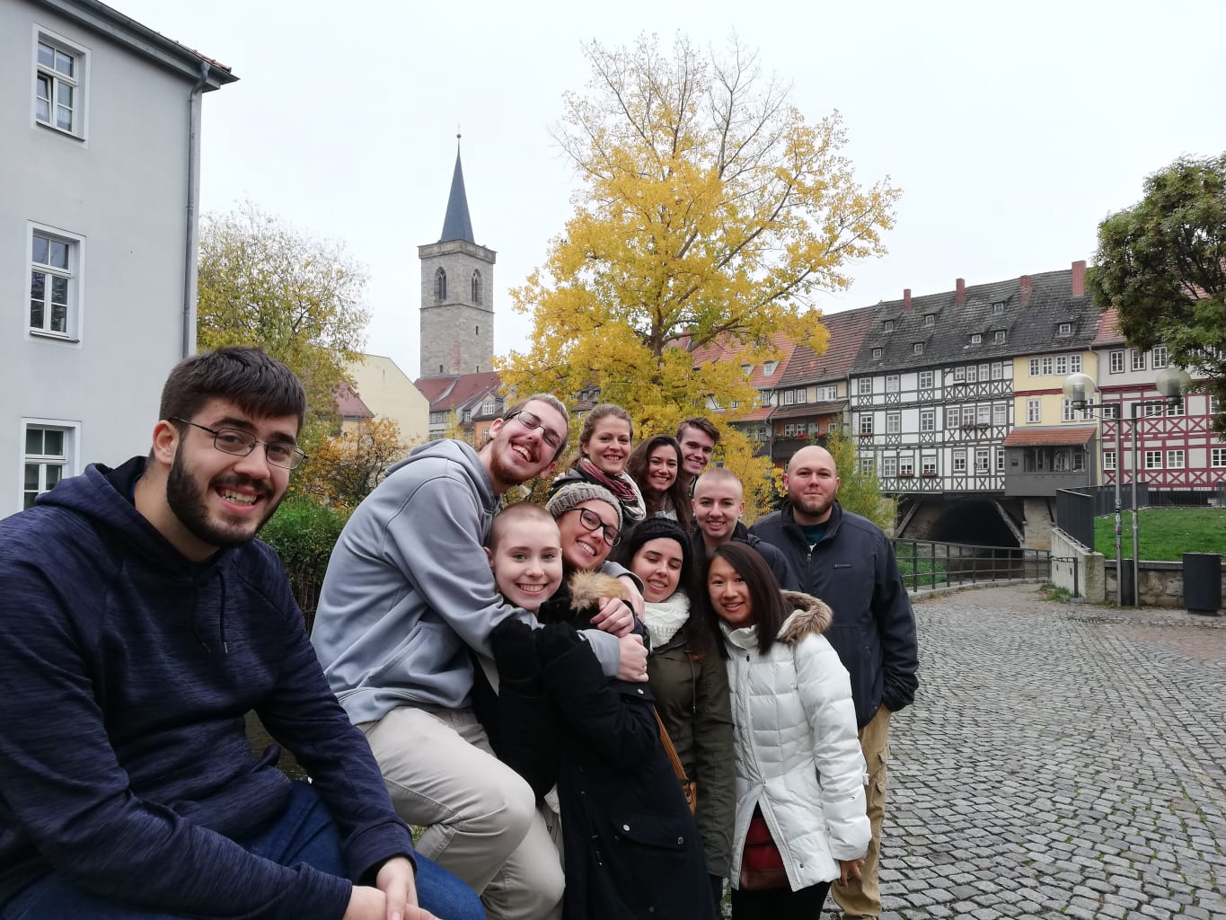 Group posing sitting in courtyard.