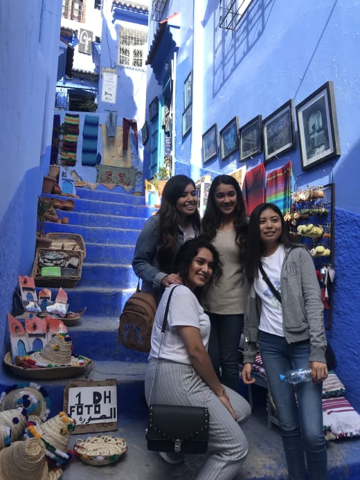 Girls posing on steps.