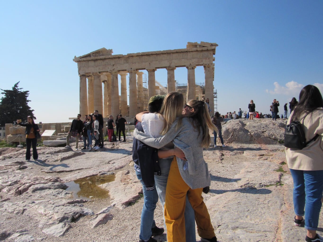 A group of students hugging.