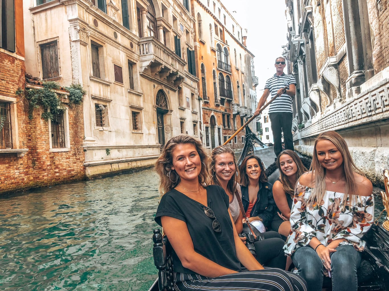 Women on a gondola in Florence, Italy.