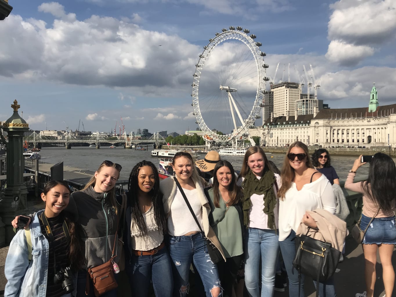 A group of students on a bridge in London.