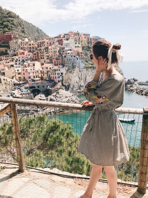 Girl profile on balcony.