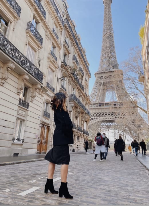 A student observing the Eiffel Tower in Paris.