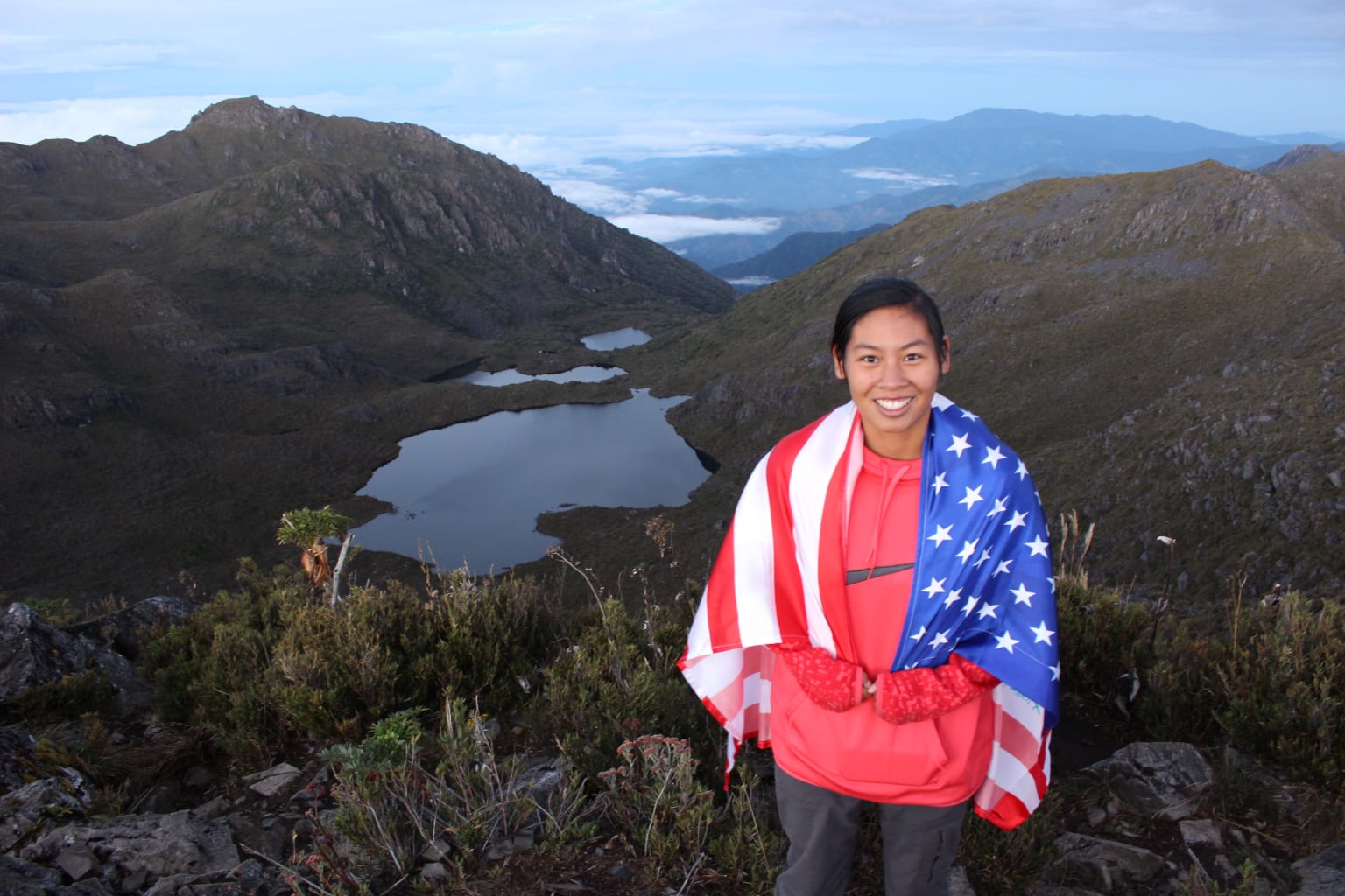 Girl in american flag posing.