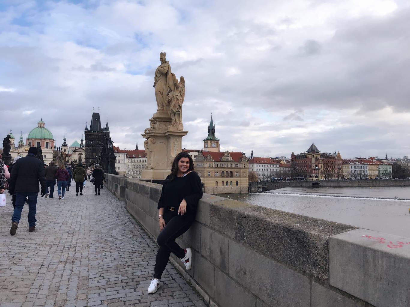 A student on a bridge in Prague, Czech Republic.