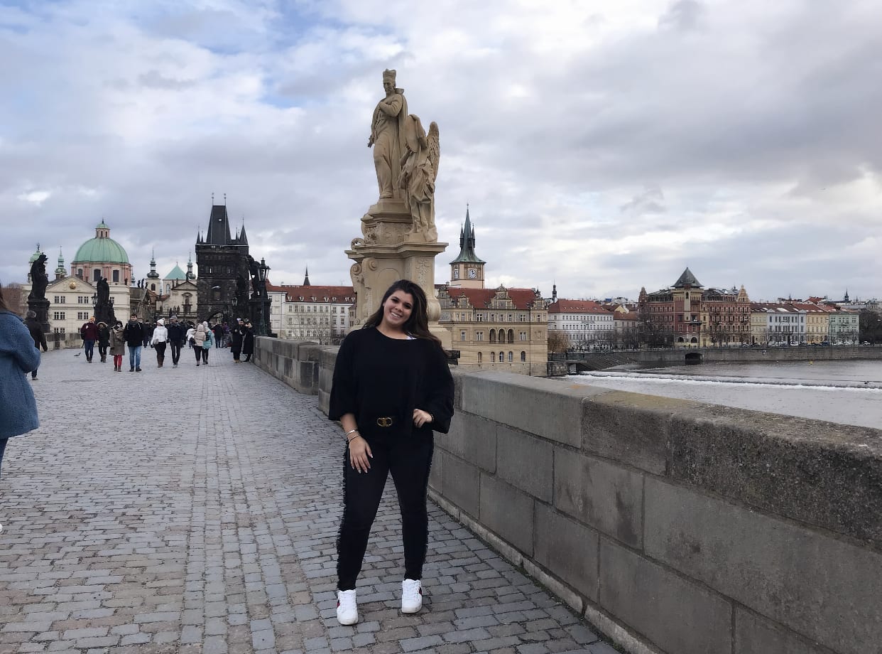 A student on a bridge in Prague.