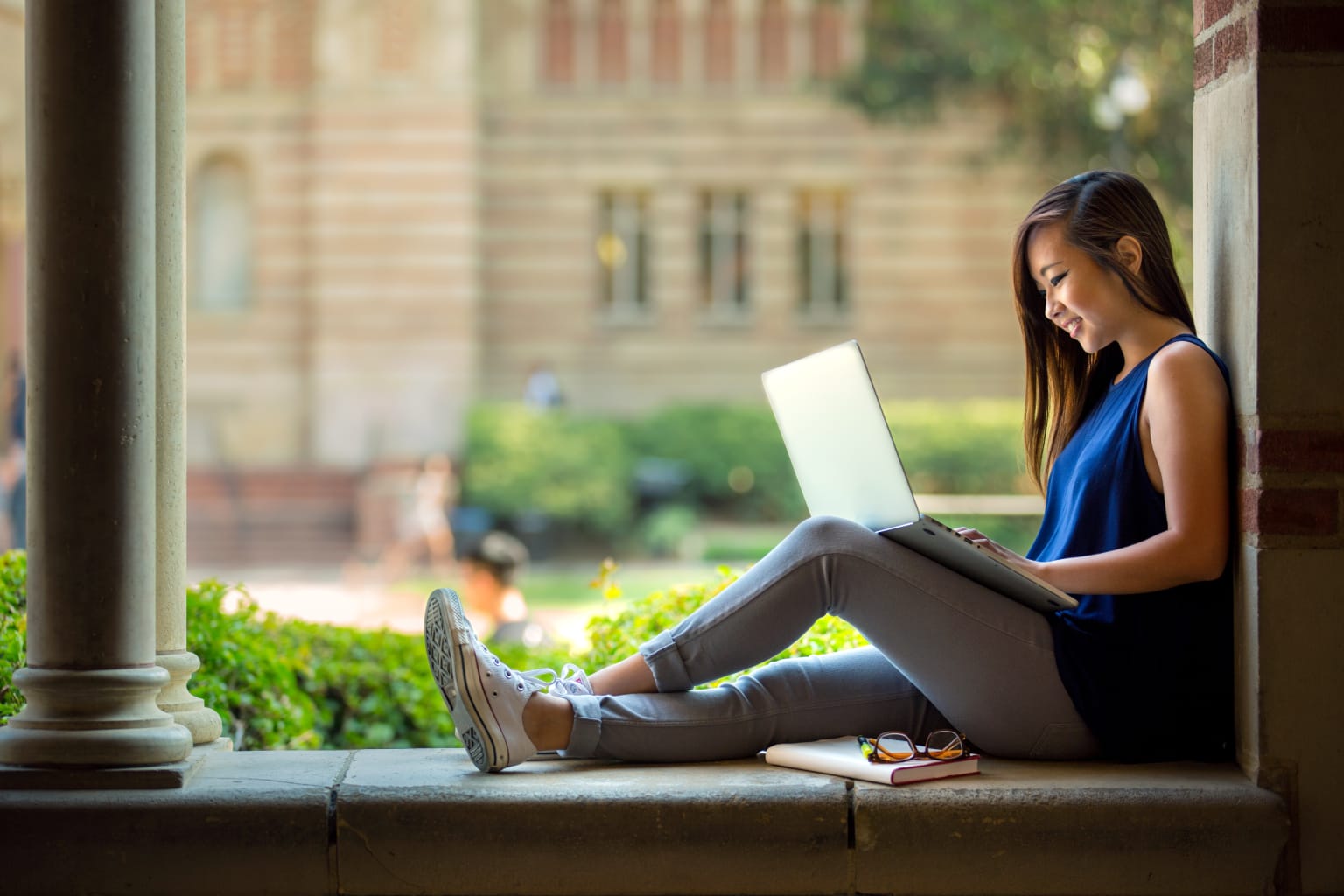 Woman using a laptop.